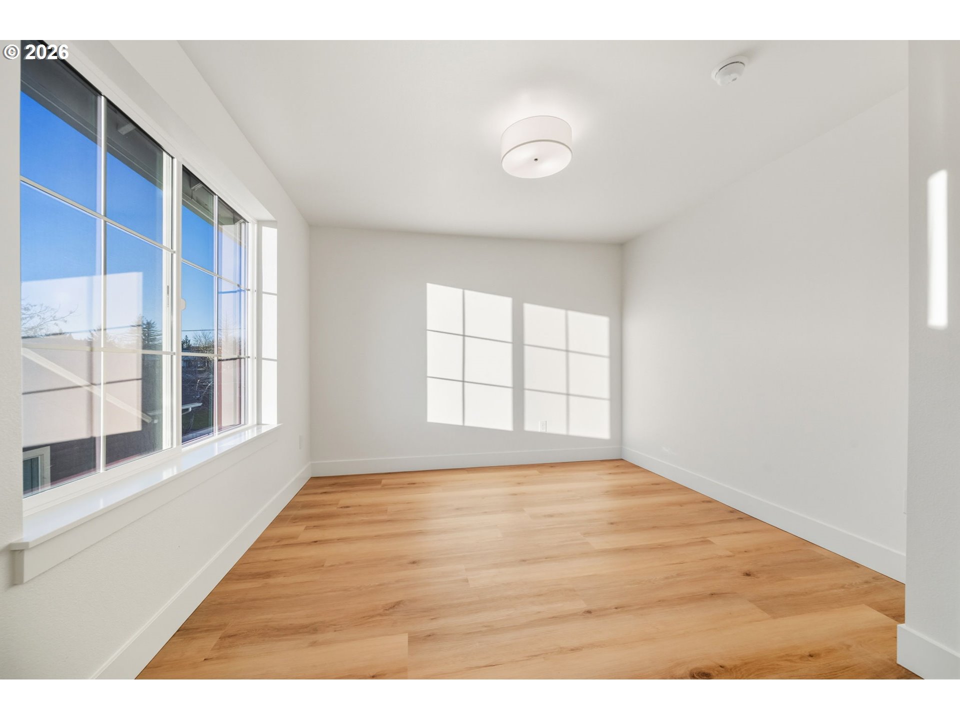 7332 Southeast Bybee Boulevard, Unit 2 Portland, OR 97206 - Photo 11 of 19 a view of an empty room with a window