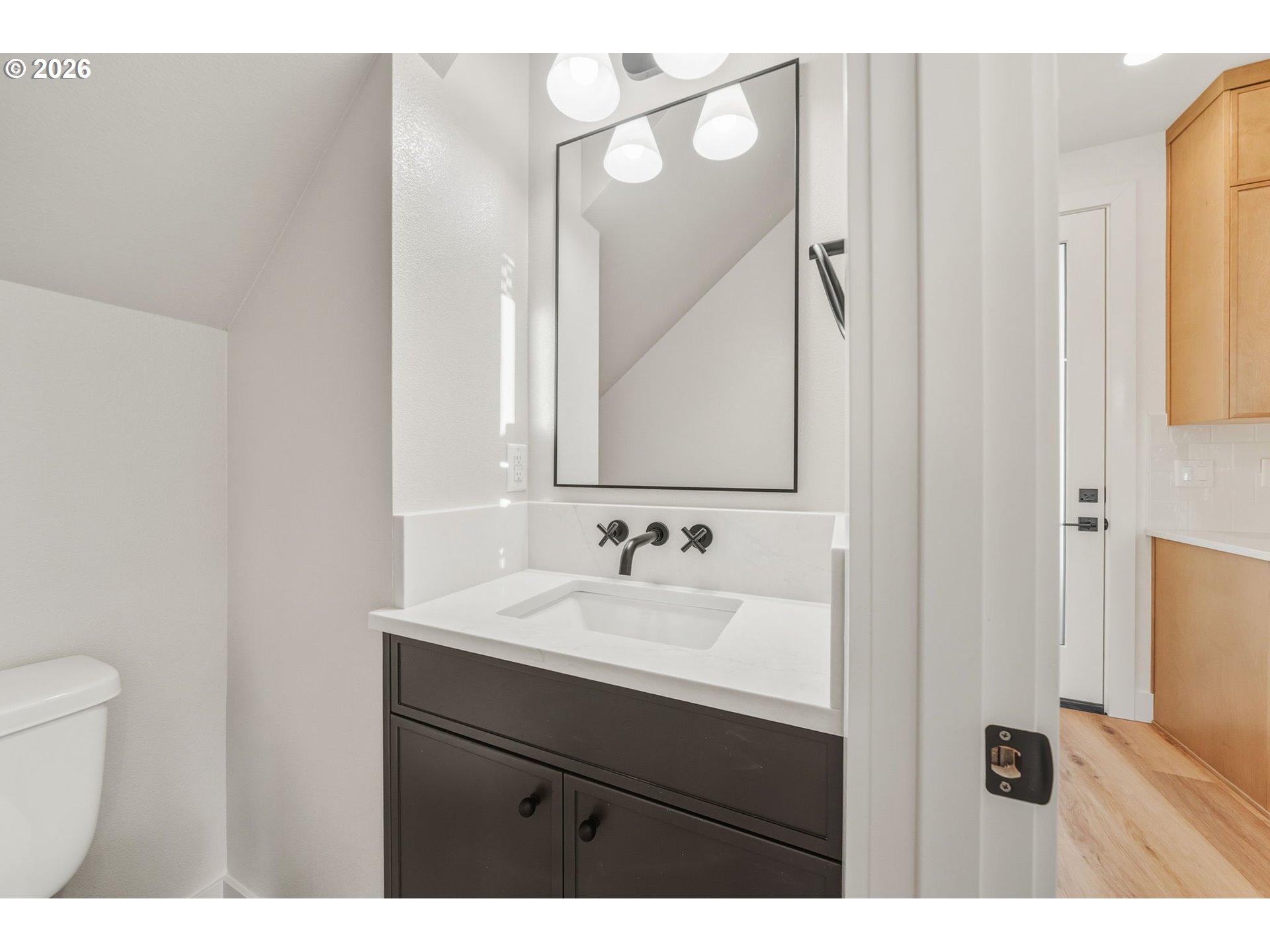 7332 Southeast Bybee Boulevard, Unit 2 Portland, OR 97206 - Photo 14 of 19 a bathroom with a sink and a mirror