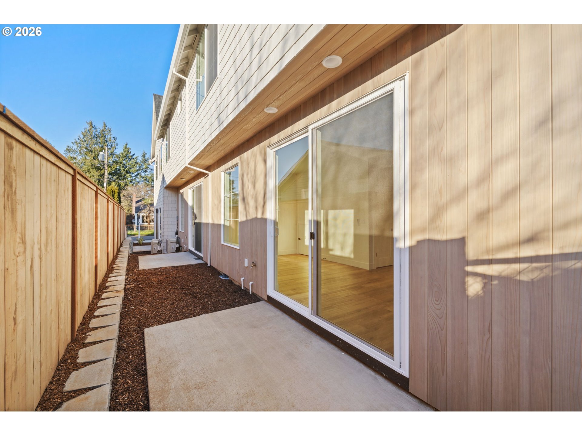 7332 Southeast Bybee Boulevard, Unit 2 Portland, OR 97206 - Photo 18 of 19 a view of a porch with wooden floor and stairs