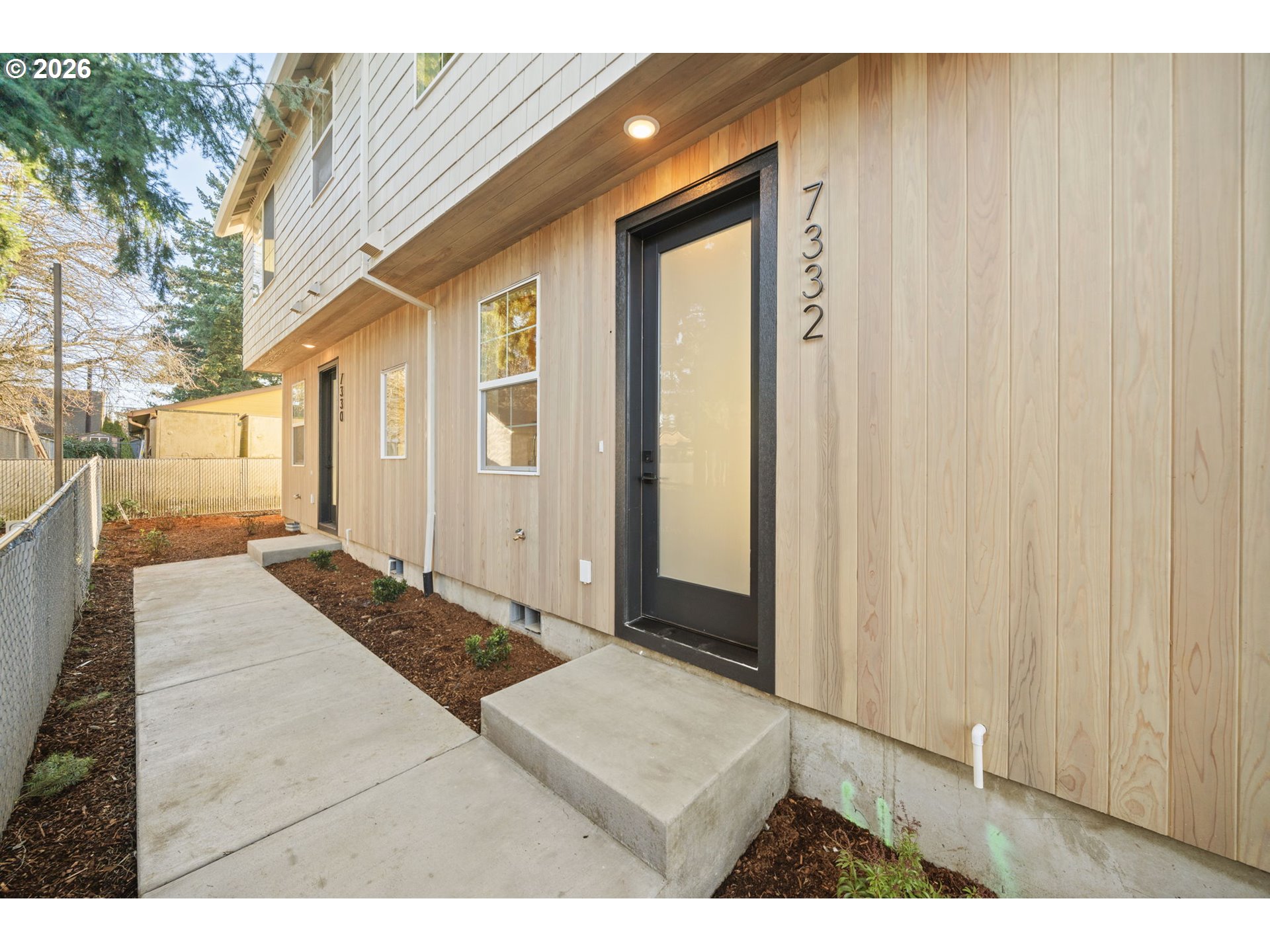 7332 Southeast Bybee Boulevard, Unit 2 Portland, OR 97206 - Photo 2 of 19 a bathroom with a sink a mirror and a shower