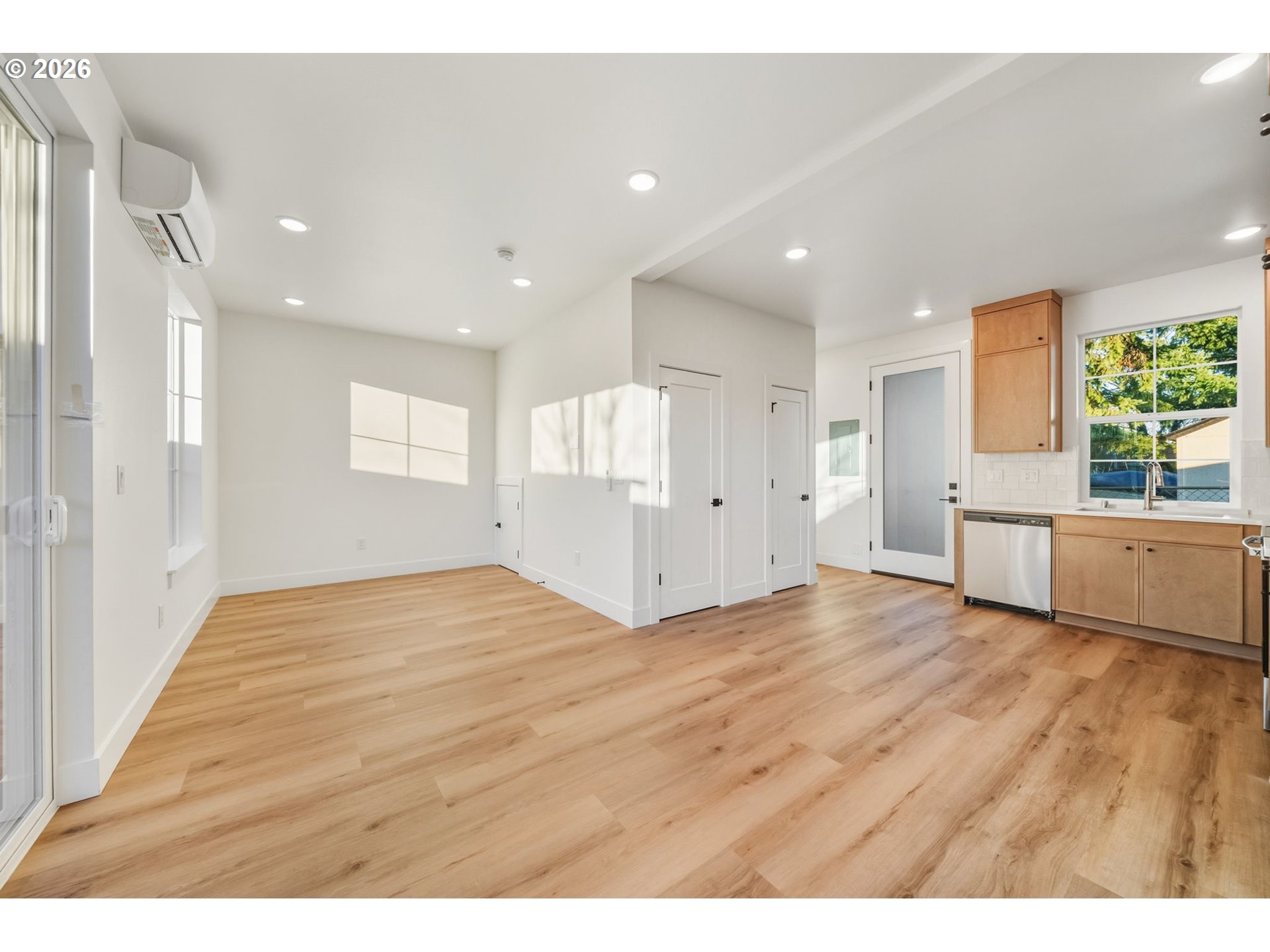 7332 Southeast Bybee Boulevard, Unit 2 Portland, OR 97206 - Photo 7 of 19 a view of an empty room window and wooden floor