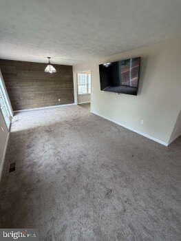 313 3rd Street Colonial Beach, VA 22443 - Photo 35 of 36 Spacious living area with modern charm.