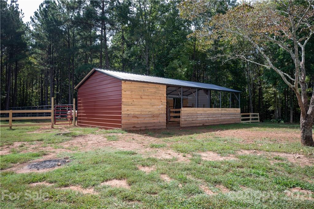1824 Ebenezer Road Smyrna, SC 29743 - Photo 4 of 47 a front view of a house with garden