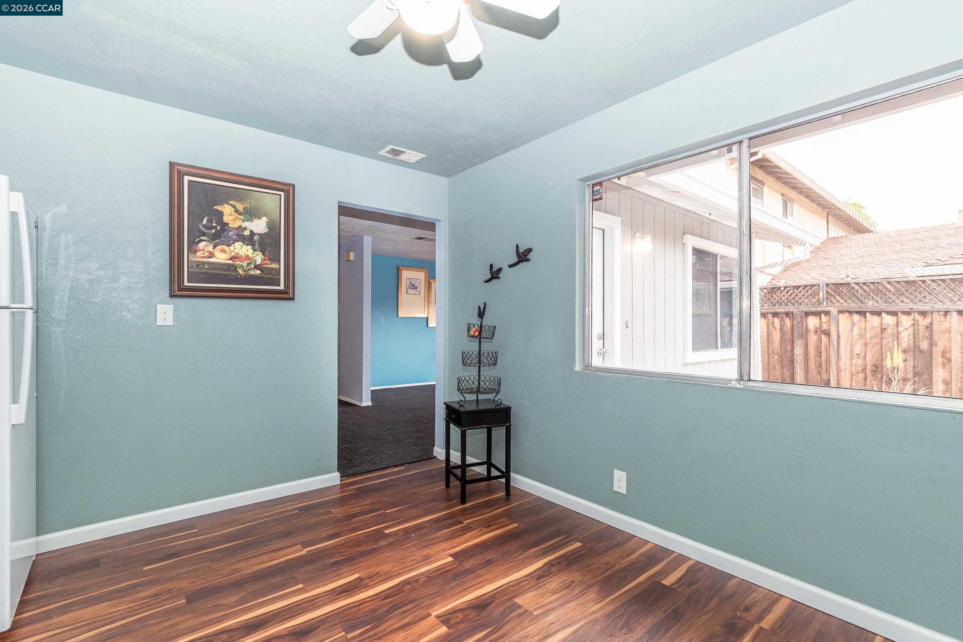 1730 Springwood Way Antioch, CA 94509 - Photo 11 of 26 a view of an empty room with a window and wooden floor