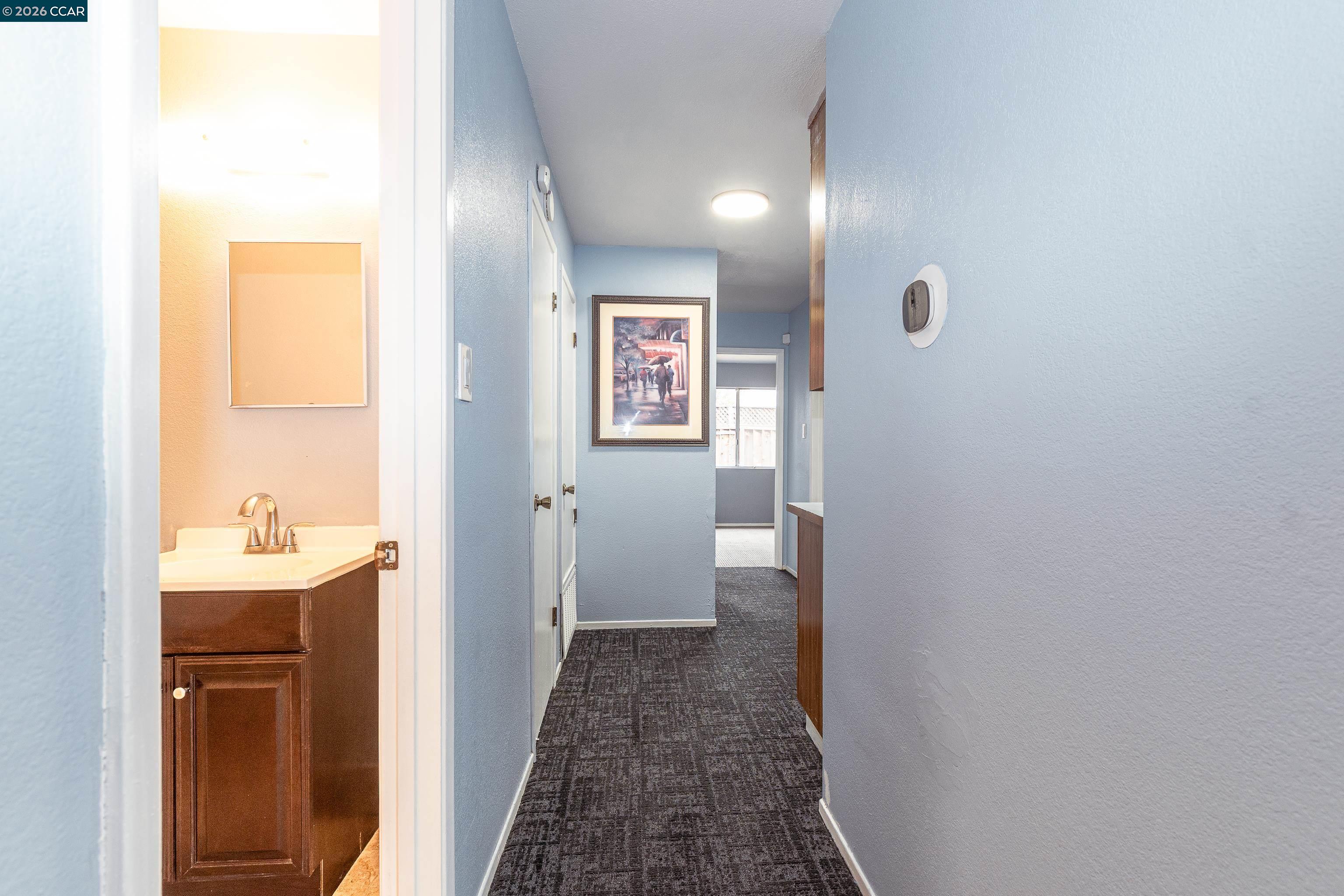 1730 Springwood Way Antioch, CA 94509 - Photo 12 of 26 a bathroom with a sink and mirror