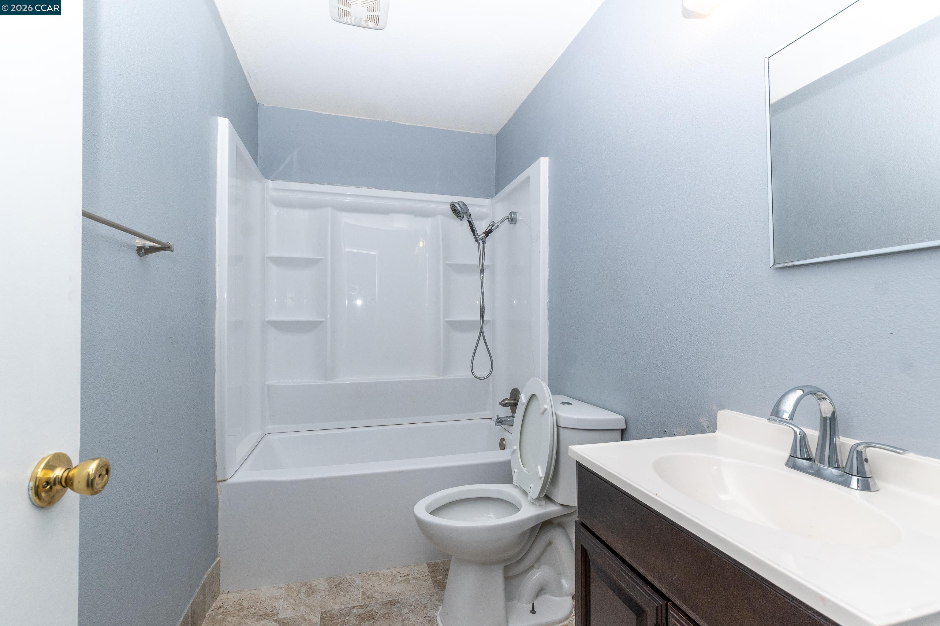 1730 Springwood Way Antioch, CA 94509 - Photo 14 of 26 a bathroom with a sink a toilet and shower