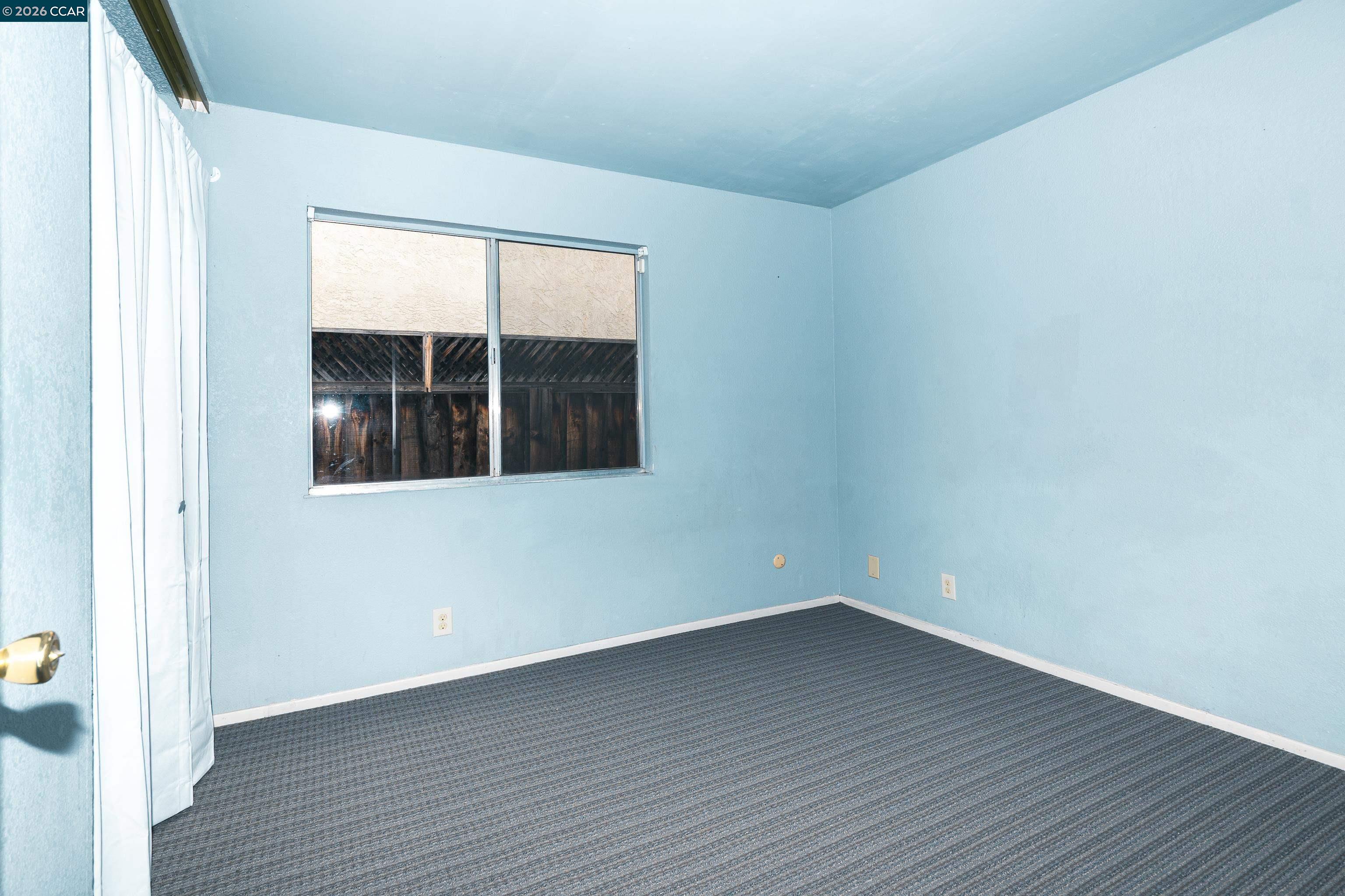 1730 Springwood Way Antioch, CA 94509 - Photo 16 of 26 a view of empty room with wooden floor and fan