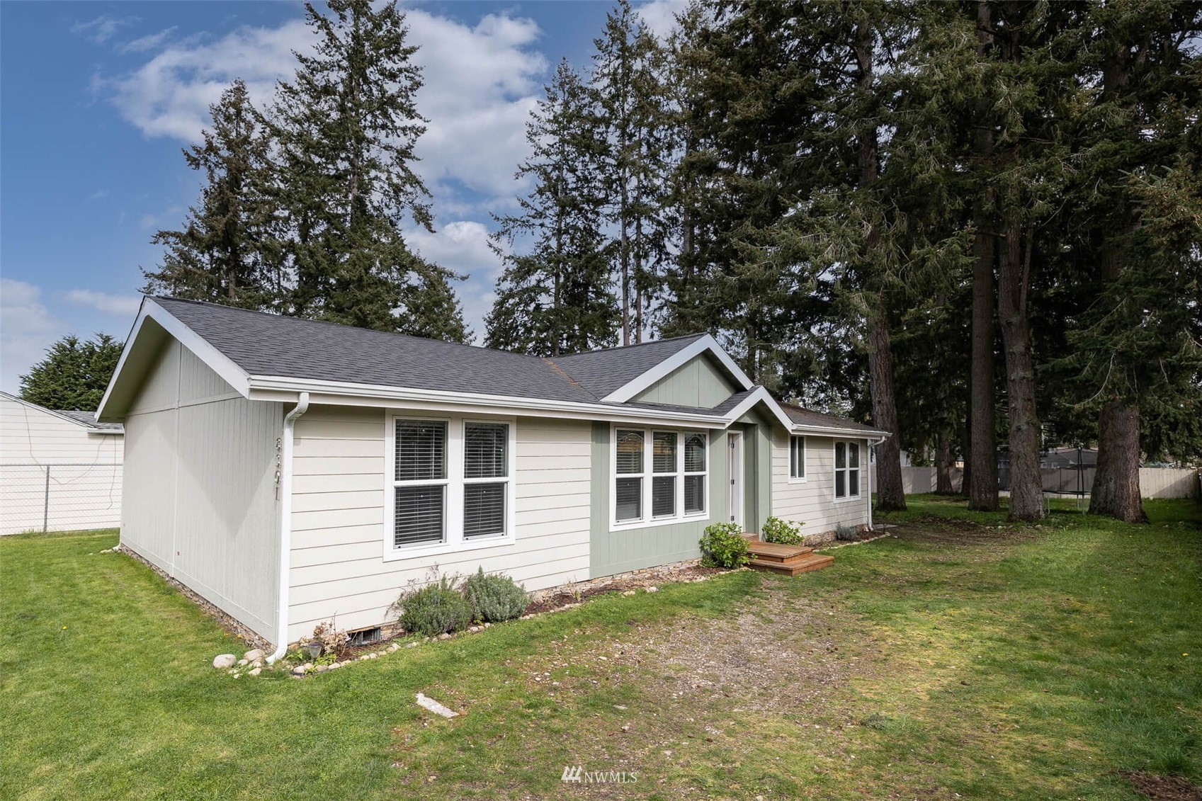 8301 Custer Road Southwest Lakewood, WA 98499 - Photo 1 of 34 a view of a house with a yard