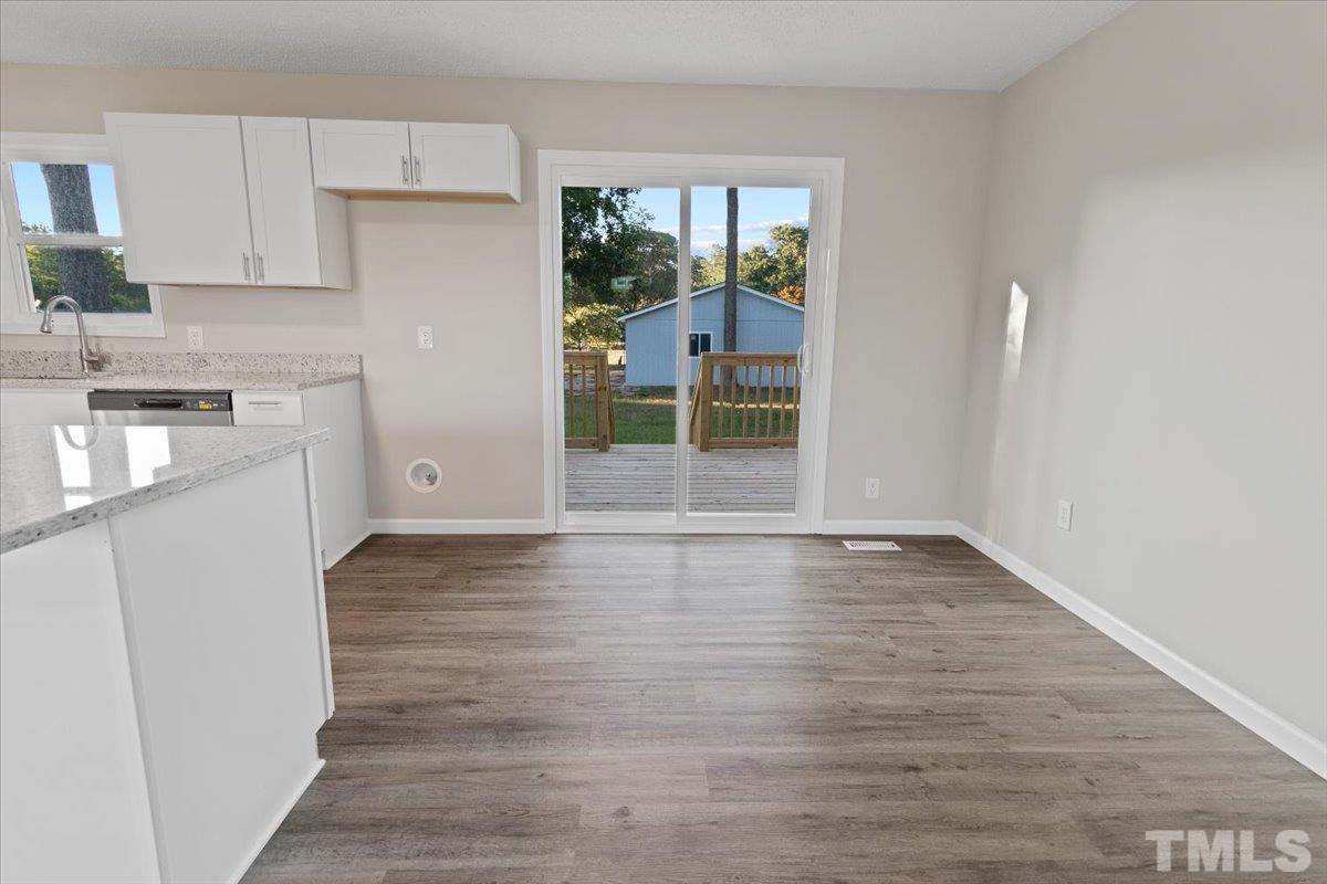 633 Outlaw Road Dudley, NC 28333 - Photo 19 of 28 a view of a kitchen with wooden floor and a sink