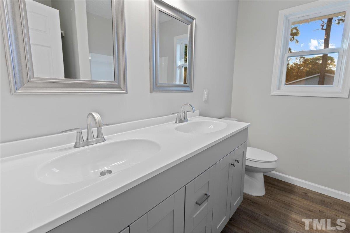 633 Outlaw Road Dudley, NC 28333 - Photo 27 of 28 a bathroom with a sink and a toilet