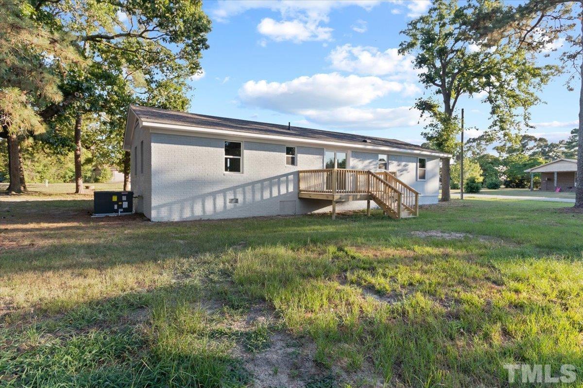 633 Outlaw Road Dudley, NC 28333 - Photo 6 of 28 a view of a house with a yard and a fountain