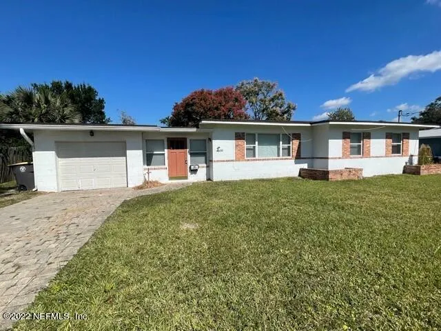 front view of a house with a yard