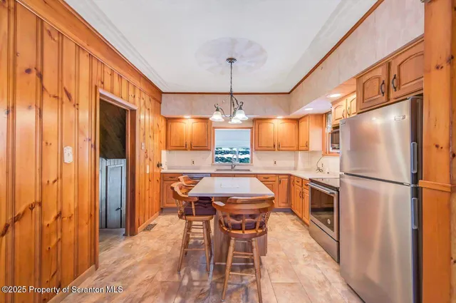 a view of a room with wooden floor and door