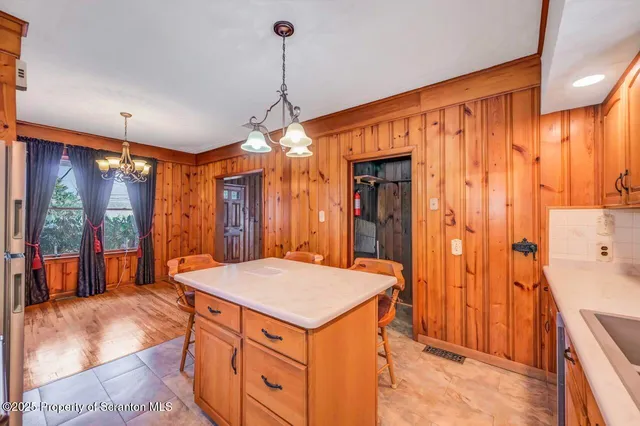 a view of a house with a door and wooden walls