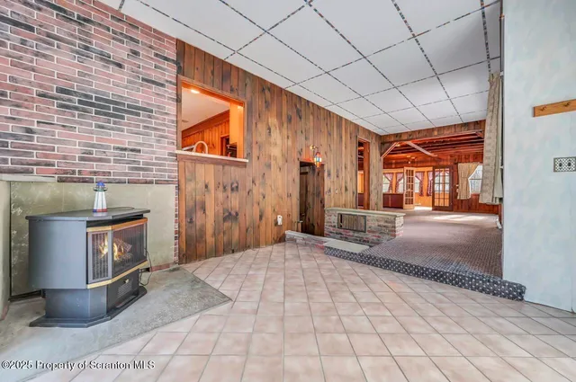 a very nice looking room with a large window and furniture