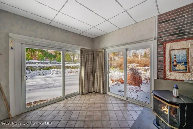 a kitchen with stainless steel appliances a refrigerator a stove a sink and a refrigerator