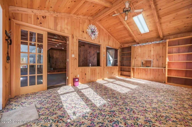 a kitchen with stainless steel appliances granite countertop a refrigerator sink stove and large window