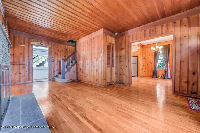 a view of a kitchen with furniture and chandelier
