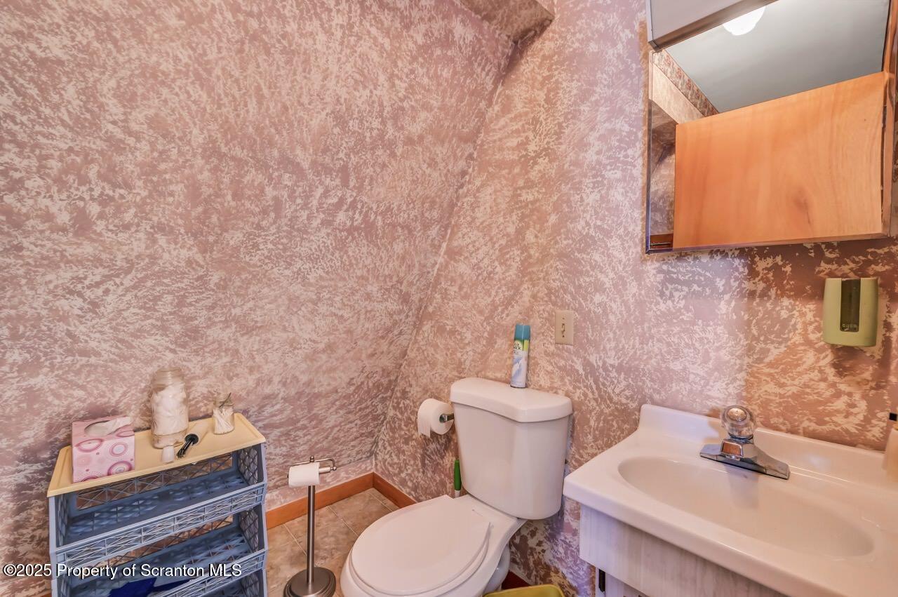 9 Marcy Road Tunkhannock, PA 18657 - Photo 78 of 97 a white toilet sitting next to a bathroom sink