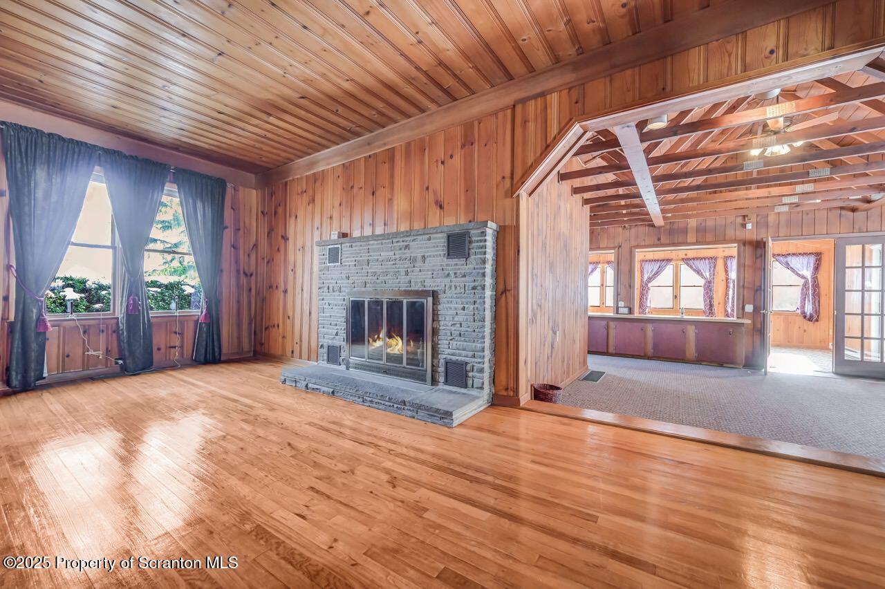 9 Marcy Road Tunkhannock, PA 18657 - Photo 8 of 97 a view of an empty room with wooden floor and a fireplace