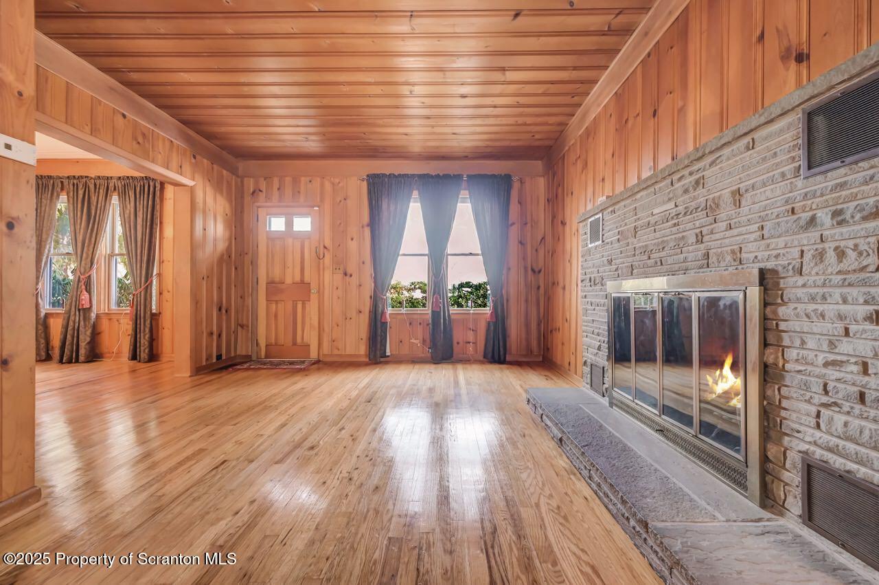 9 Marcy Road Tunkhannock, PA 18657 - Photo 9 of 97 an empty room with windows and fireplace