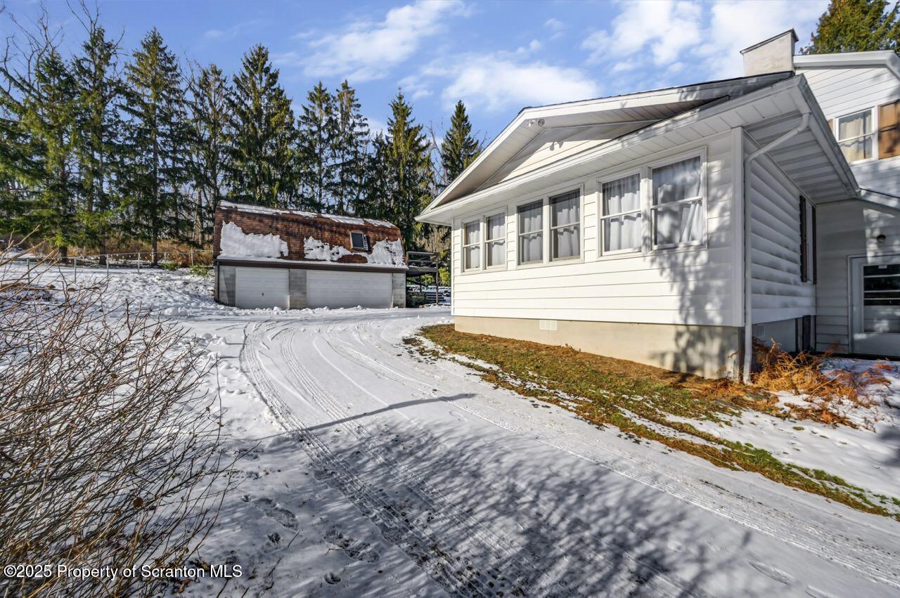 9 Marcy Road Tunkhannock, PA 18657 - Photo 91 of 97 a view of a house with snow on the side of the road