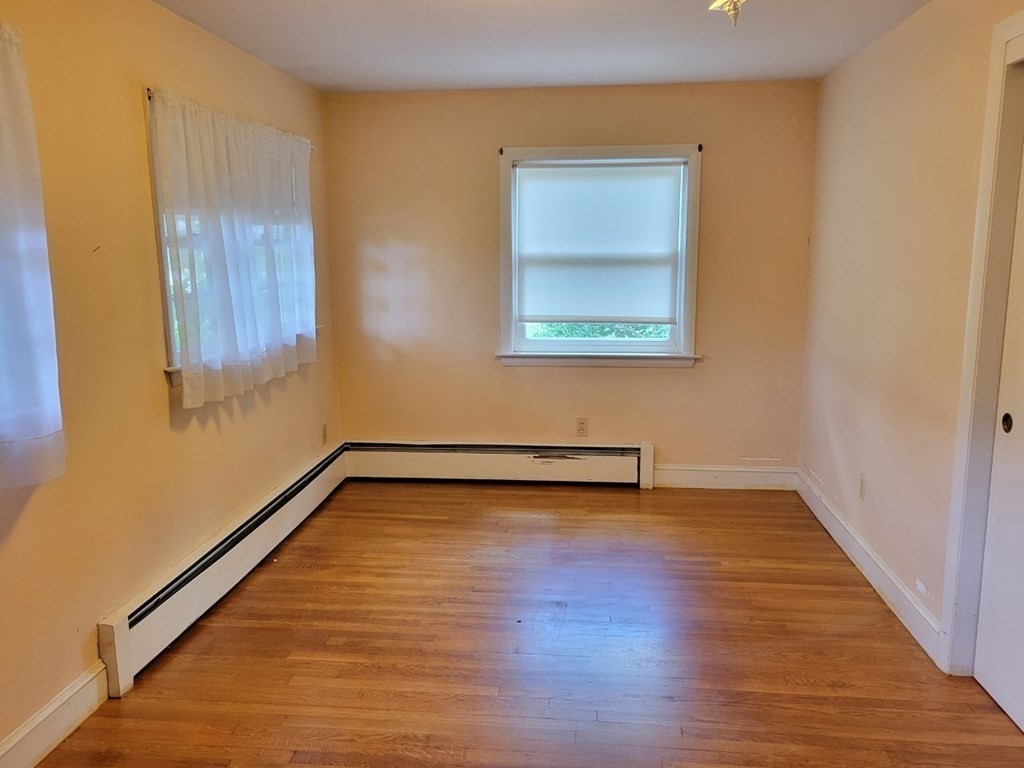 38 Bigelow Road Lancaster, MA 01523 - Photo 13 of 26 a view of a room with wooden floor and window