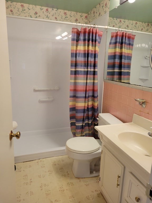 38 Bigelow Road Lancaster, MA 01523 - Photo 16 of 26 a bathroom with a sink toilet and shower