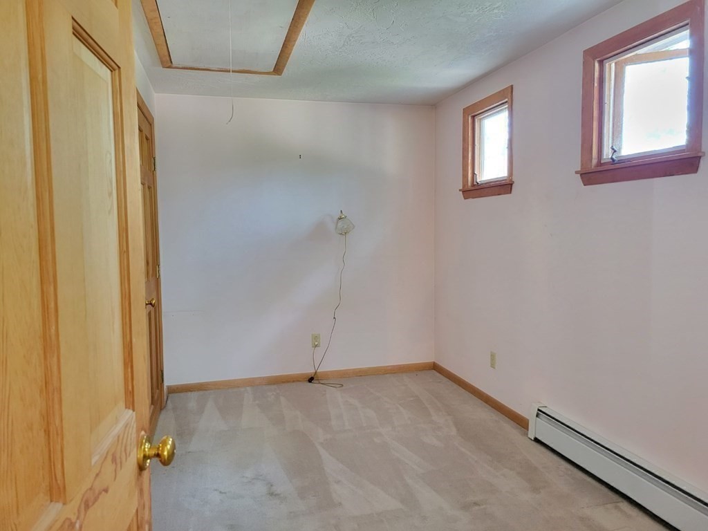 38 Bigelow Road Lancaster, MA 01523 - Photo 19 of 26 wooden floor and window in an empty room