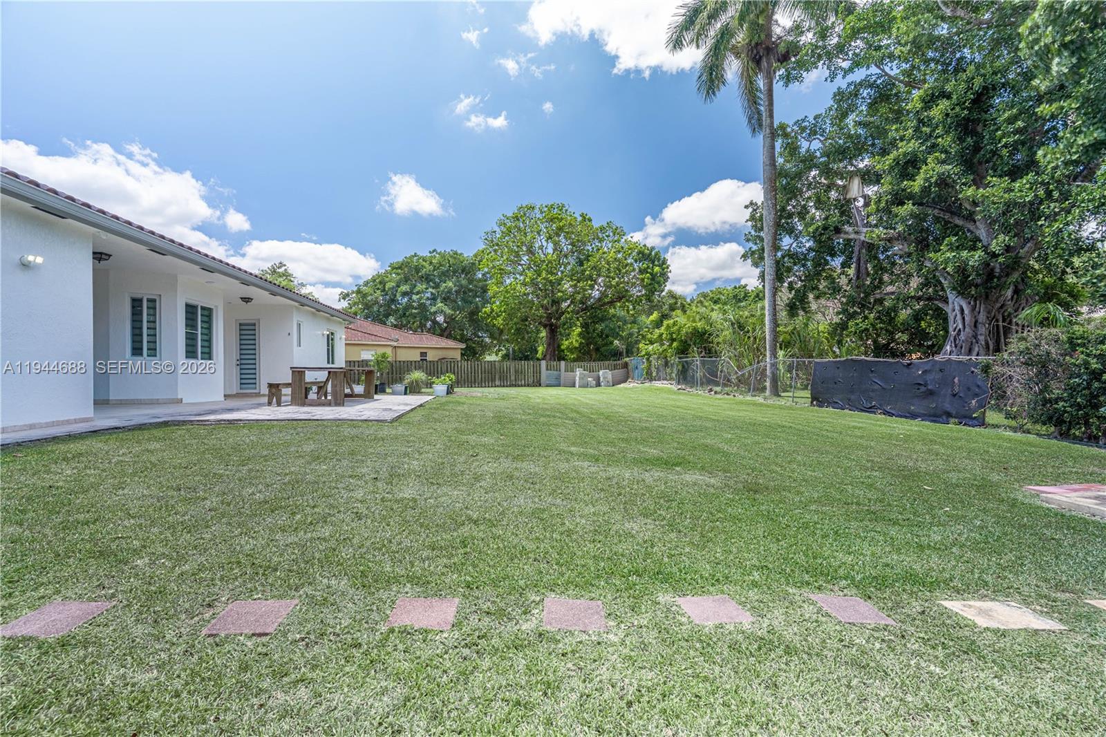 26602 Southwest 149th Court Homestead, FL 33032 - Photo 12 of 66 a front view of a house with garden