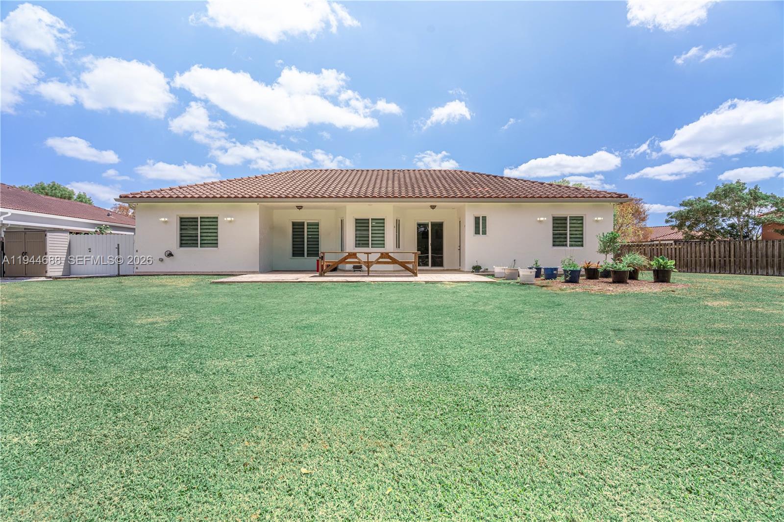 26602 Southwest 149th Court Homestead, FL 33032 - Photo 14 of 66 a front view of house with yard and green space