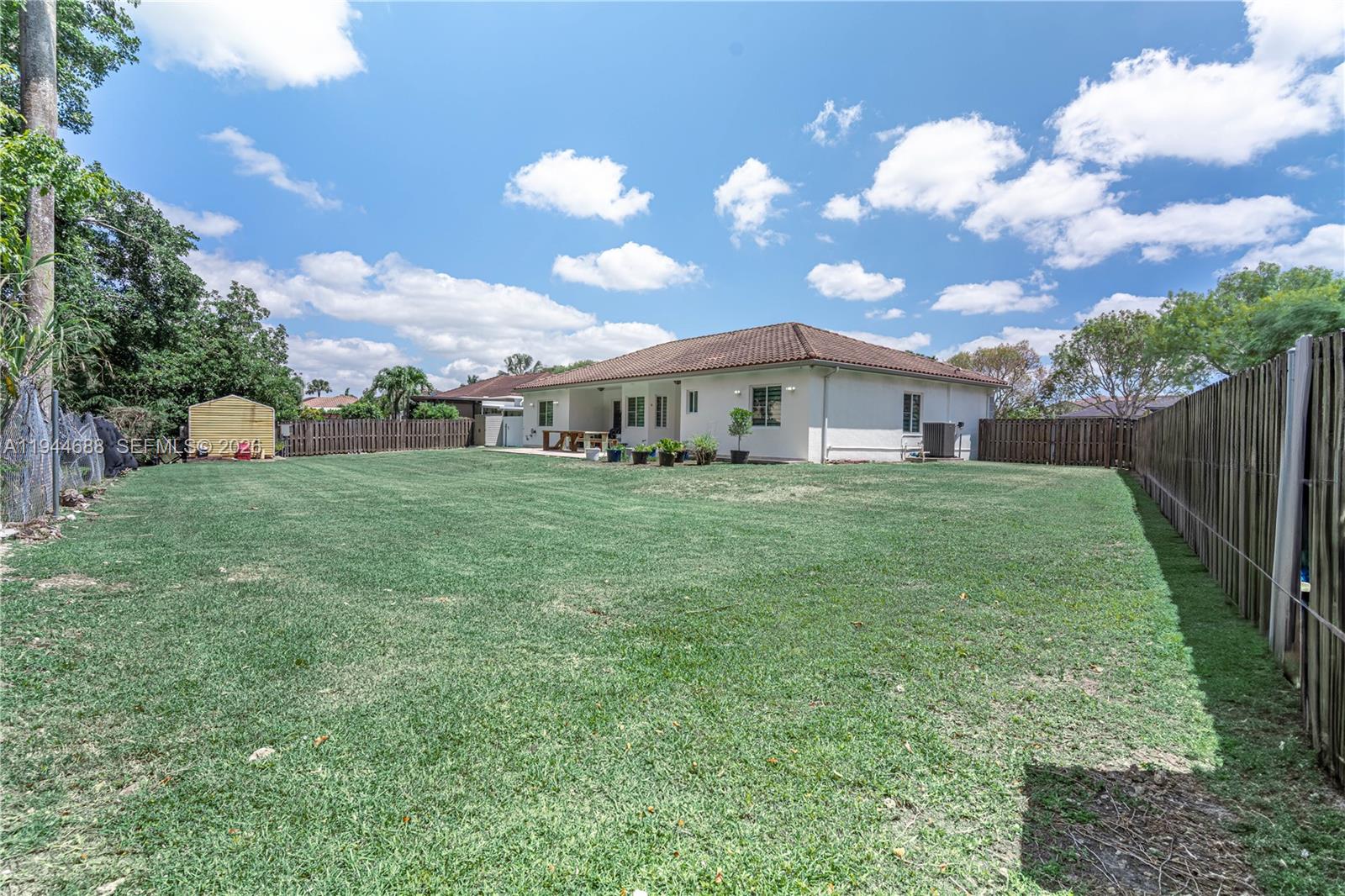 26602 Southwest 149th Court Homestead, FL 33032 - Photo 15 of 66 a view of a house with a yard
