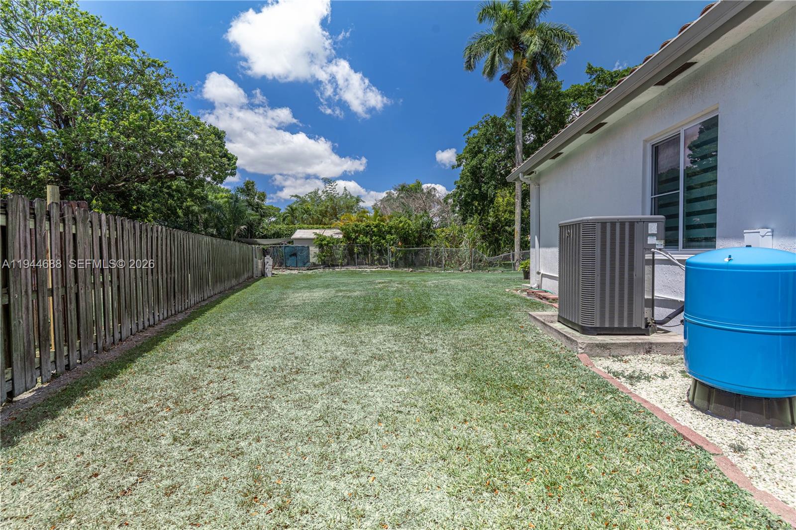 26602 Southwest 149th Court Homestead, FL 33032 - Photo 19 of 66 a view of a backyard with barn and a large tree