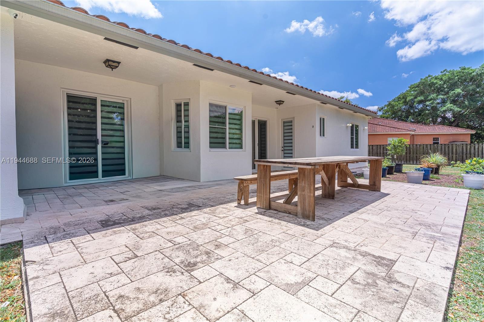 26602 Southwest 149th Court Homestead, FL 33032 - Photo 20 of 66 a outdoor space with lots of table and chairs
