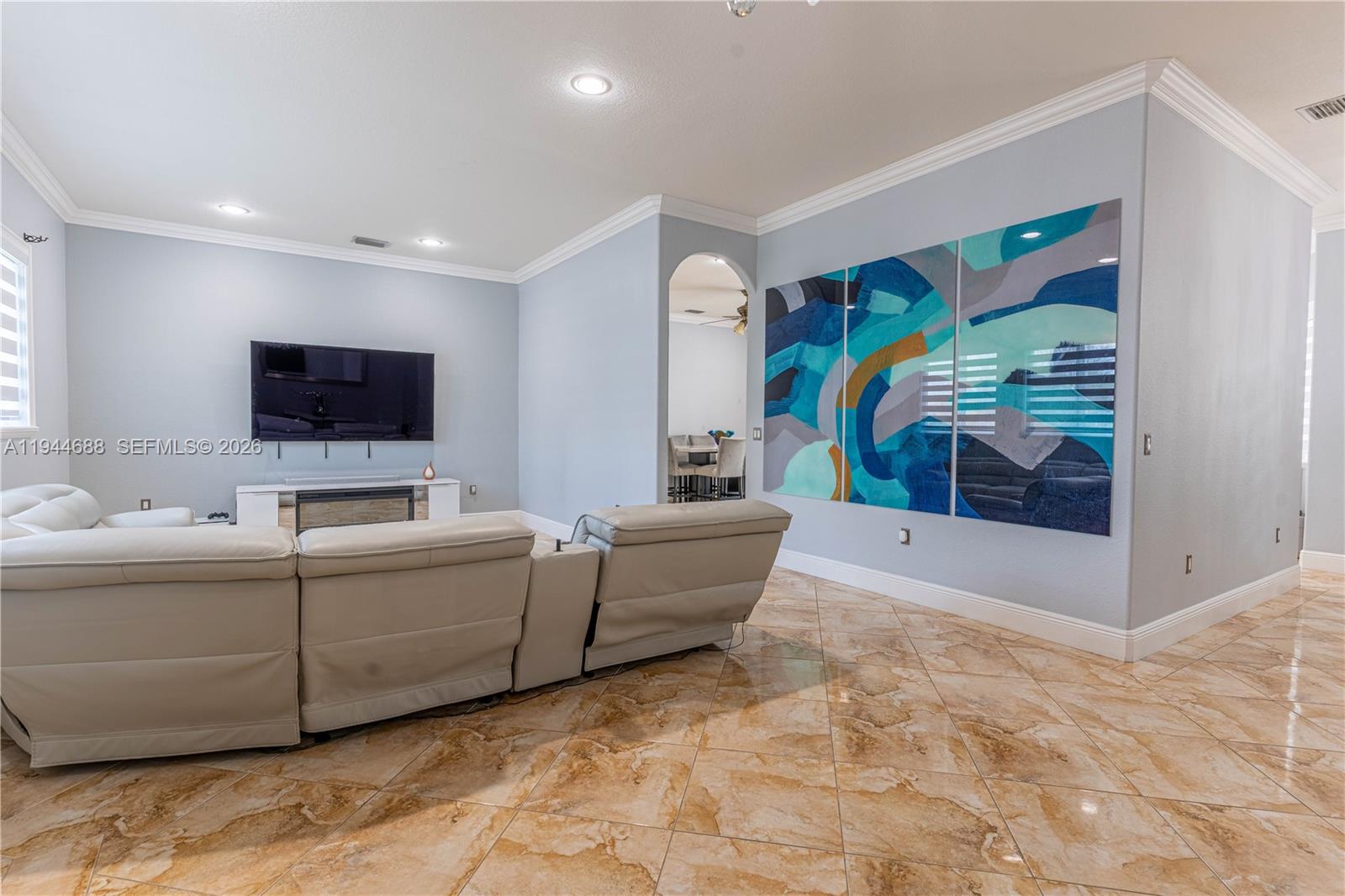 26602 Southwest 149th Court Homestead, FL 33032 - Photo 23 of 66 a living room with furniture and a flat screen tv