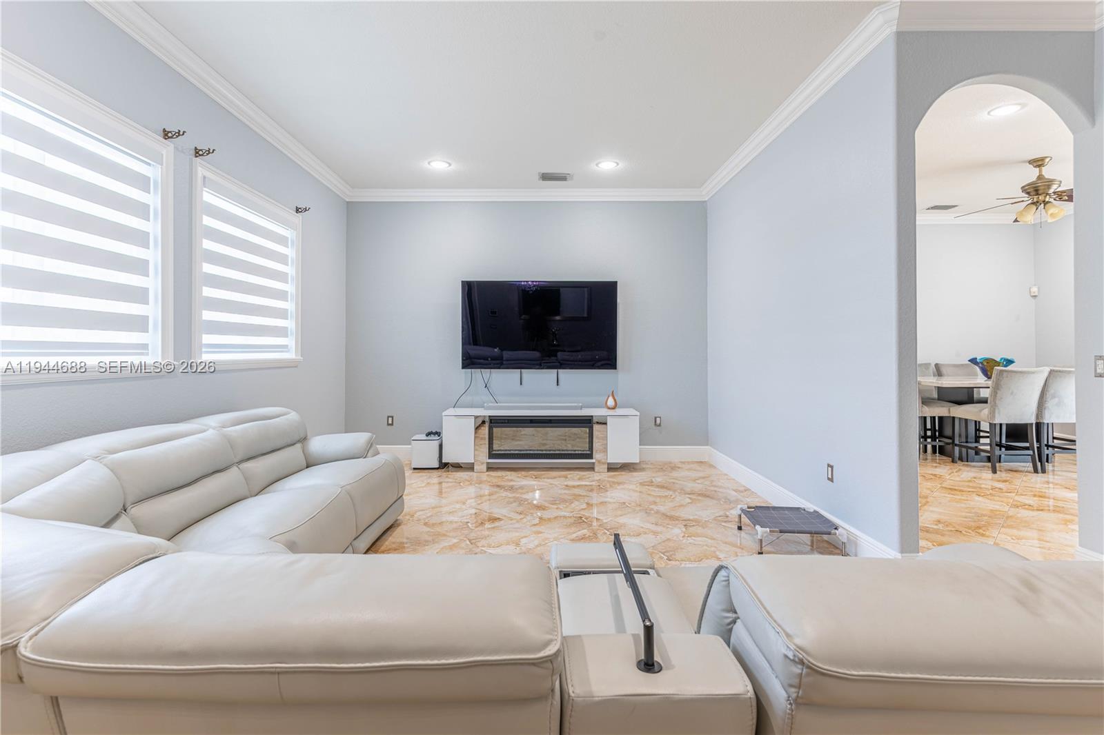 26602 Southwest 149th Court Homestead, FL 33032 - Photo 24 of 66 a living room with furniture and a flat screen tv