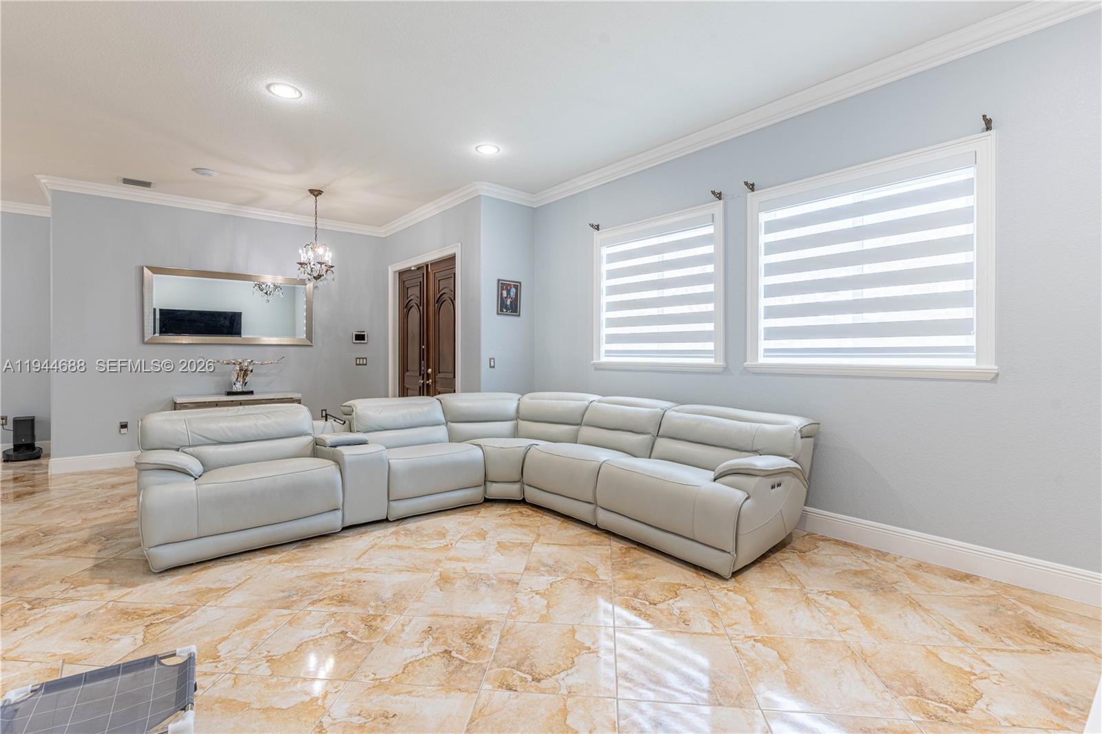26602 Southwest 149th Court Homestead, FL 33032 - Photo 26 of 66 a living room with furniture and a flat screen tv