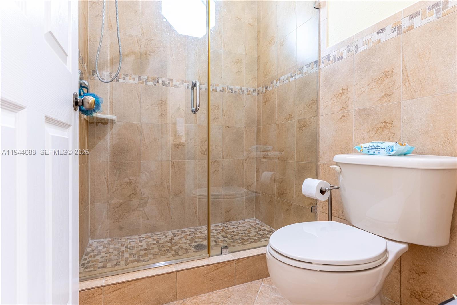 26602 Southwest 149th Court Homestead, FL 33032 - Photo 38 of 66 a white toilet sitting next to a bath tub