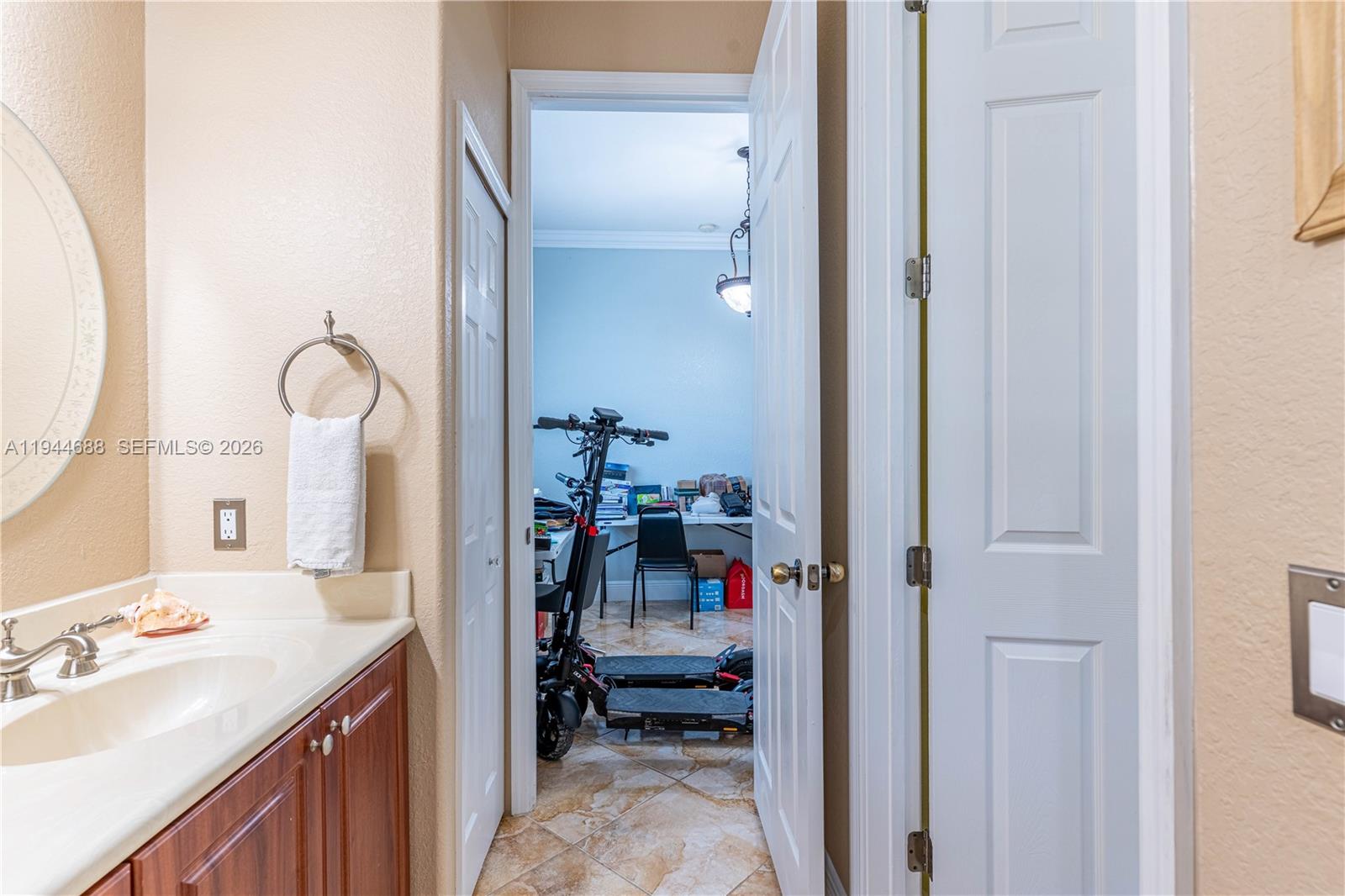26602 Southwest 149th Court Homestead, FL 33032 - Photo 40 of 66 a en suite bathroom with a sink and a mirror
