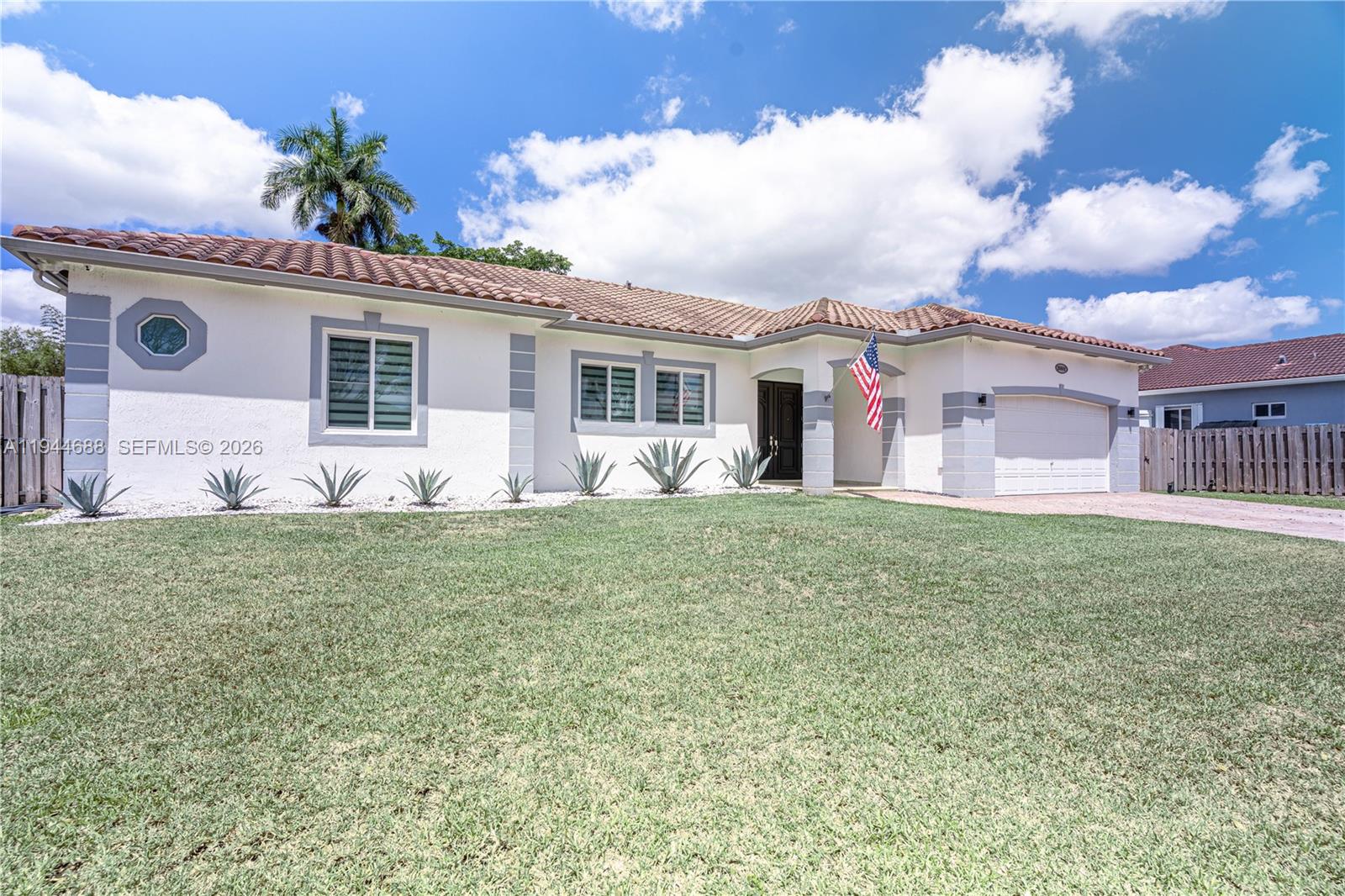 26602 Southwest 149th Court Homestead, FL 33032 - Photo 4 of 66 a front view of a house with garden