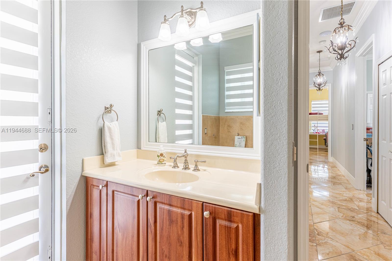 26602 Southwest 149th Court Homestead, FL 33032 - Photo 45 of 66 a bathroom with a granite countertop sink and a mirror