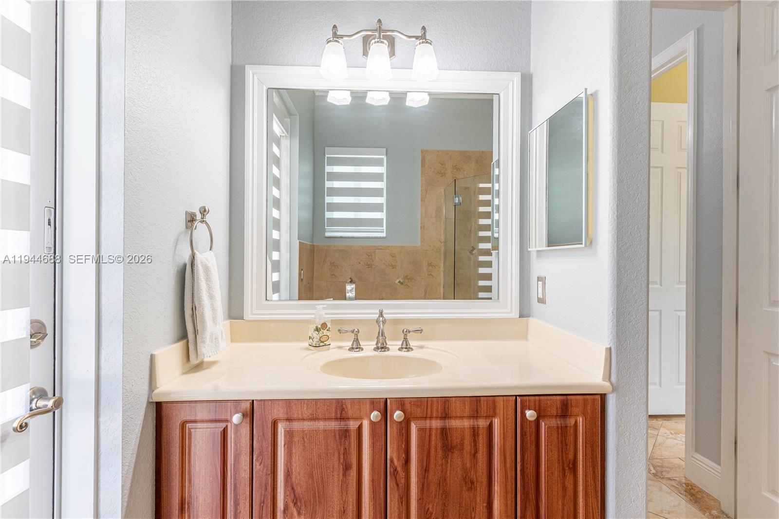 26602 Southwest 149th Court Homestead, FL 33032 - Photo 46 of 66 a bathroom with a sink double vanity and a mirror