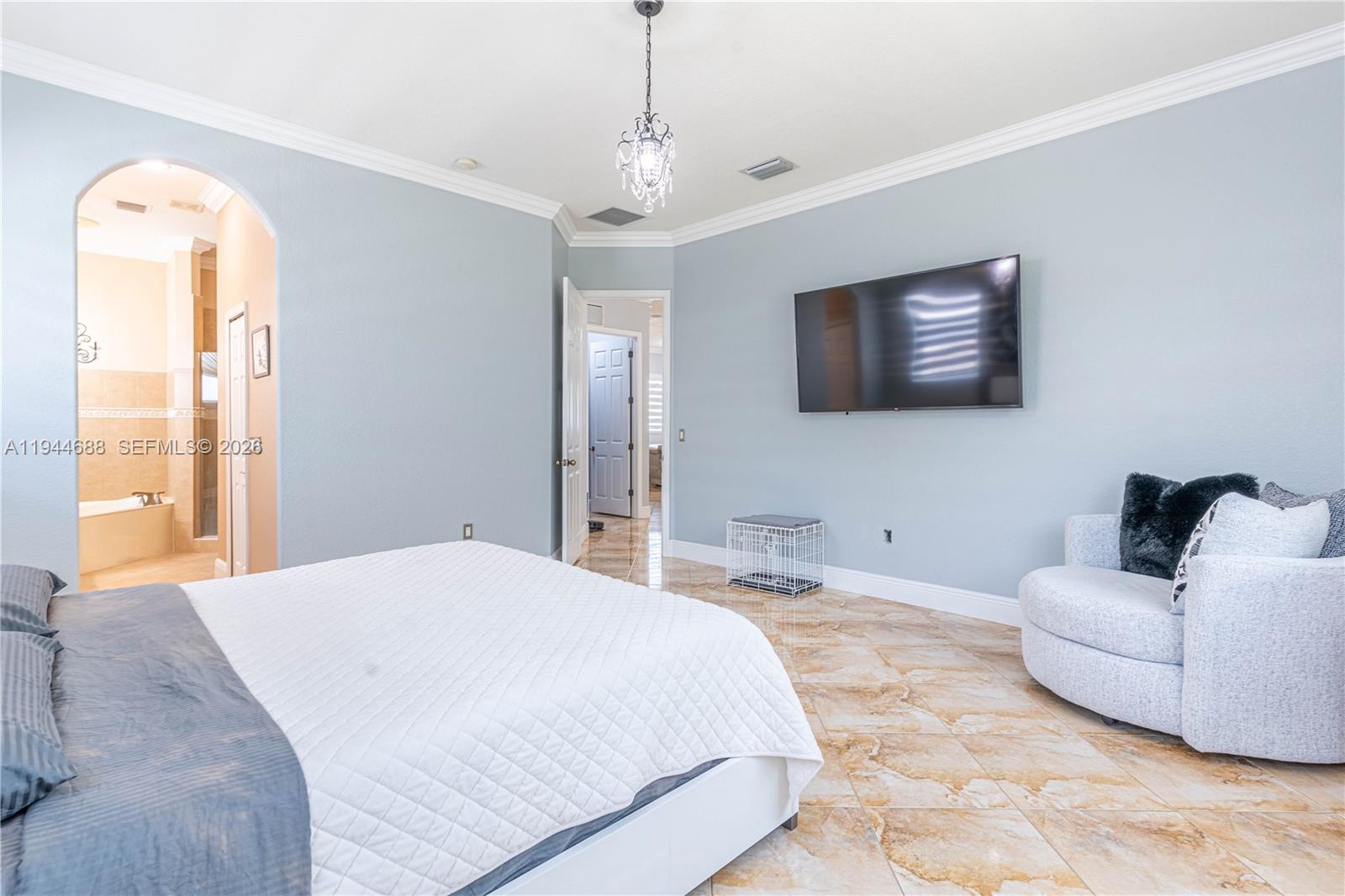 26602 Southwest 149th Court Homestead, FL 33032 - Photo 49 of 66 a spacious bedroom with a bed and a couch