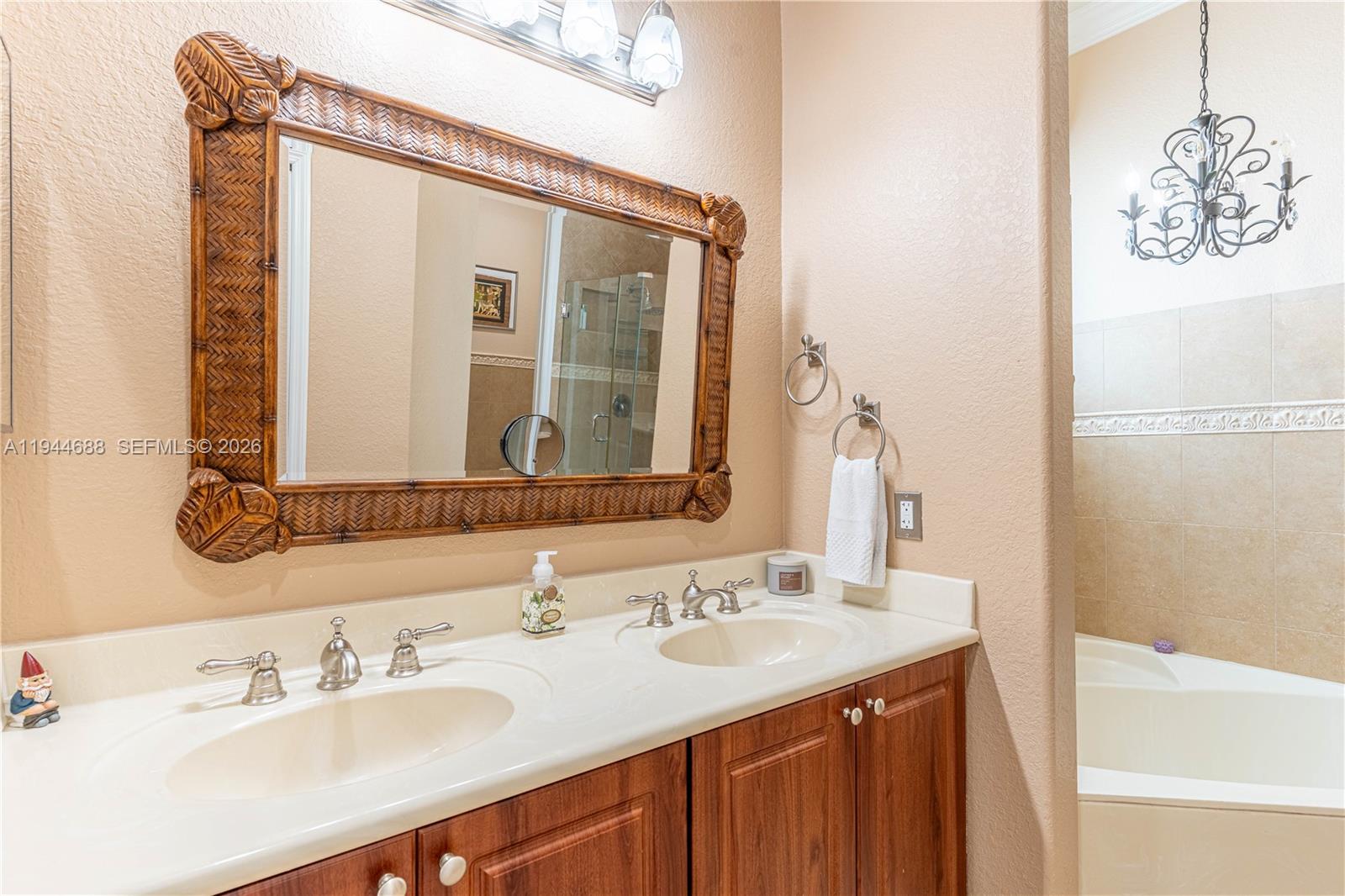 26602 Southwest 149th Court Homestead, FL 33032 - Photo 51 of 66 a bathroom with a sink and a mirror