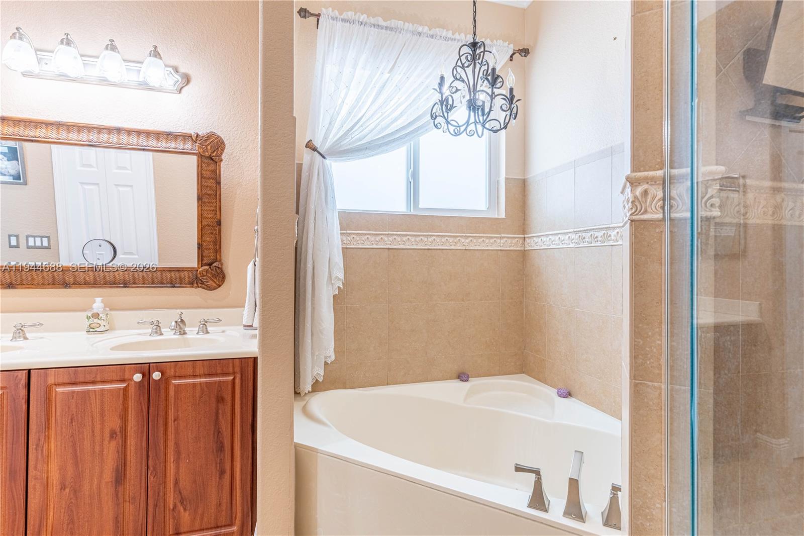 26602 Southwest 149th Court Homestead, FL 33032 - Photo 53 of 66 a bathroom with a sink and a mirror