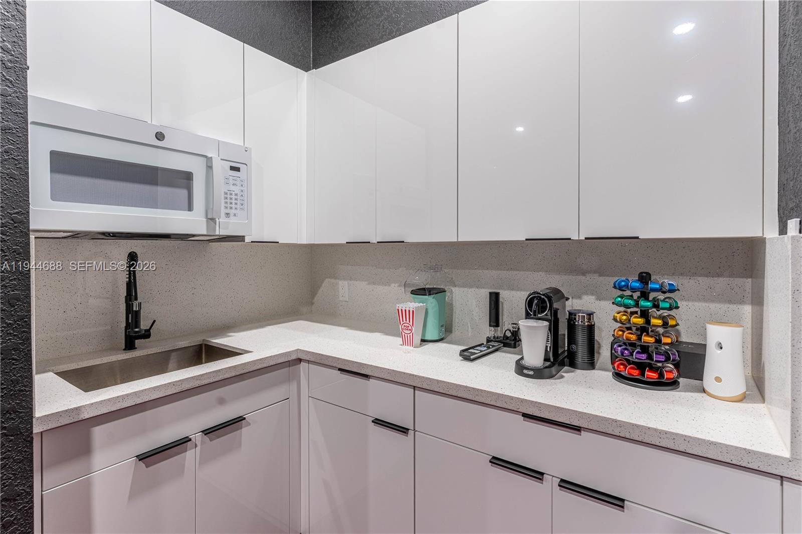 26602 Southwest 149th Court Homestead, FL 33032 - Photo 61 of 66 a kitchen with stainless steel appliances granite countertop a sink a stove and cabinets