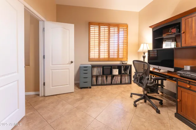 a view of a hallway with wooden shelves