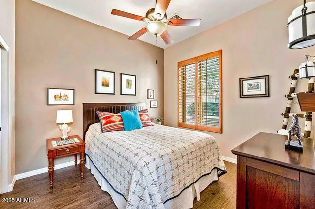 a view of a patio with couches and table and chairs and potted plants