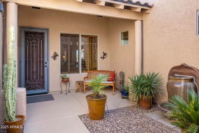 an aerial view of a house with swimming pool garden and patio