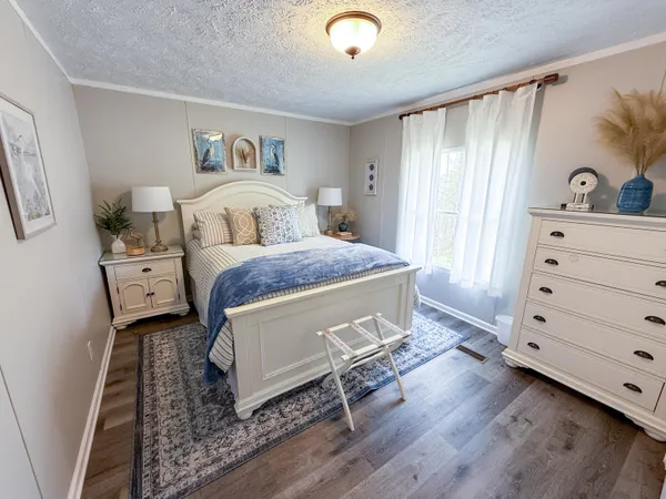 a living room with a bed and furniture